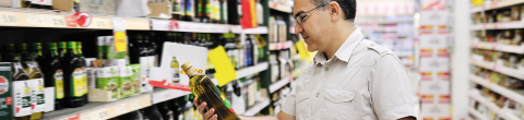 man shopping for authentic extra-virgin olive oil