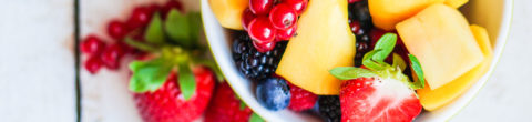 a bowl full of colorful fresh fruits which are high vibrational foods