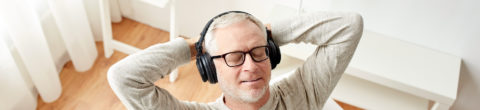 man listening to music raising his vibration for better health