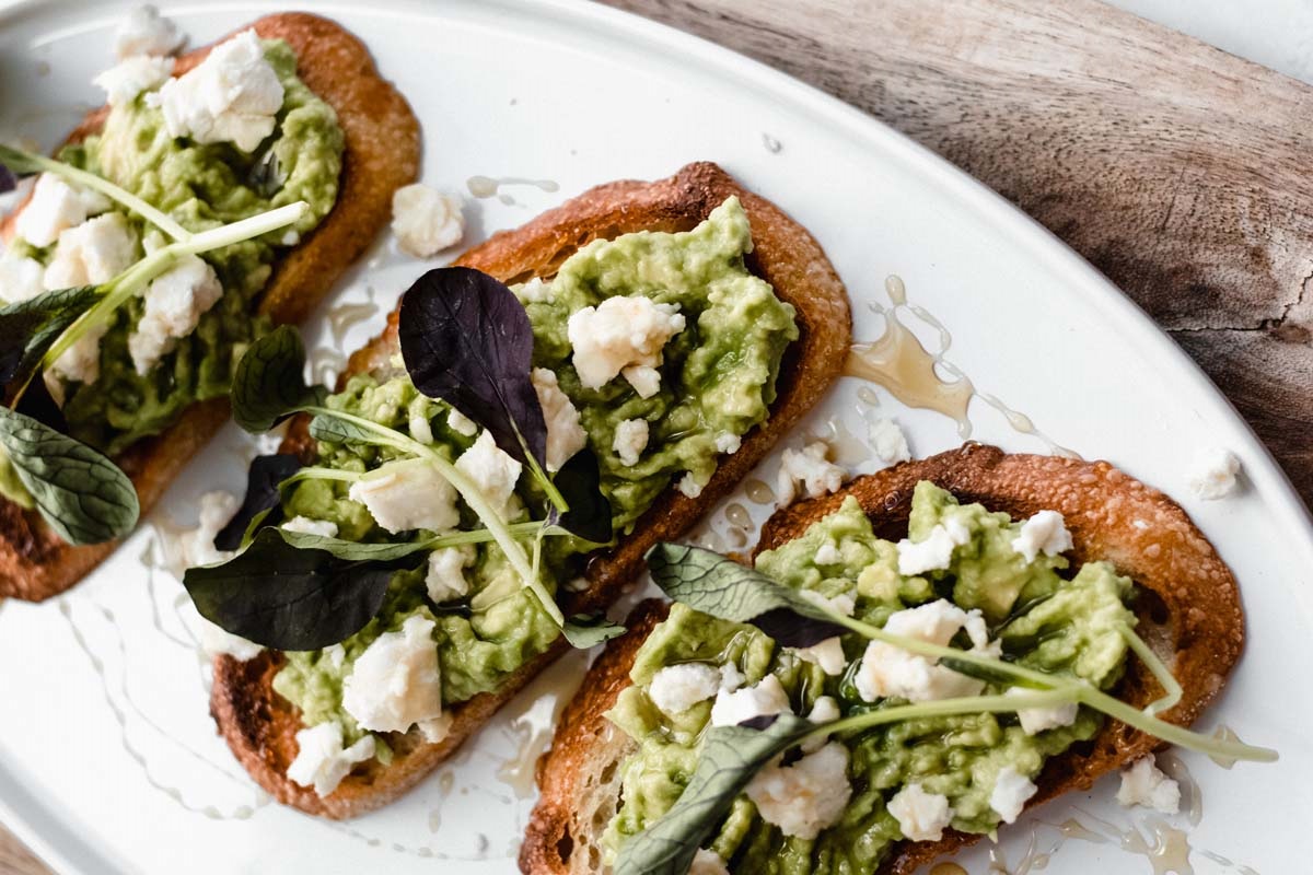 avocado toast with blood orange olive oil and goat cheese