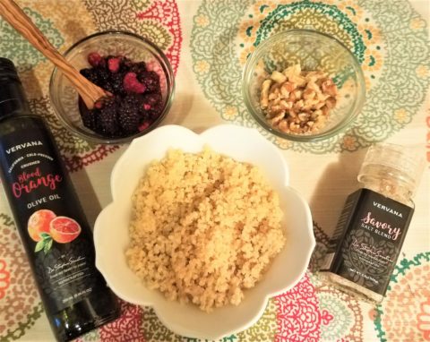 healthy breakfast recipe with quinoa, blood orange flavored olive oil, berries, nuts and natural salt